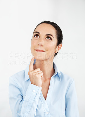 Buy stock photo Businesswoman deep in thought against a white background