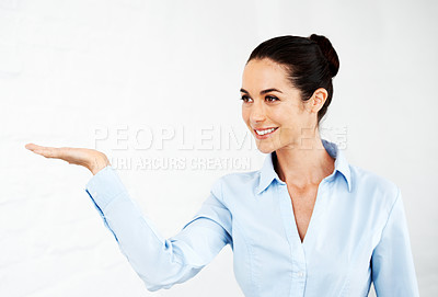 Buy stock photo Smiling businesswoman presenting blank copyspace to you