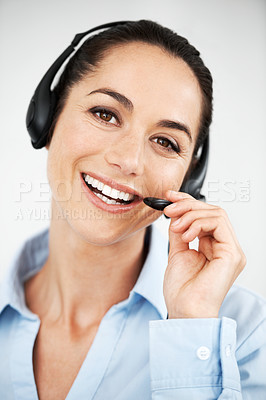 Buy stock photo Attractive female customer service agent using a headset for client services calls