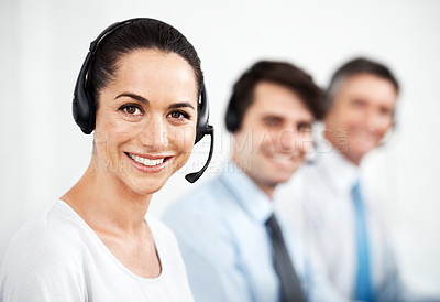 Buy stock photo Positive customer service agents at work while wearing headsets