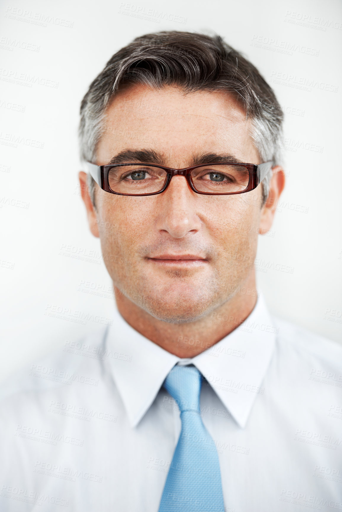 Buy stock photo Handsome mature businessman wearing glasses against a white background