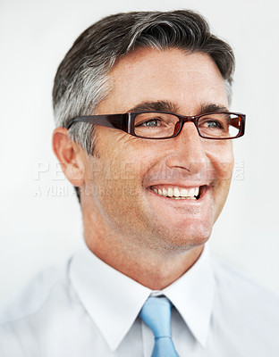 Buy stock photo Handsome mature businessman wearing glasses against a white background