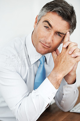 Buy stock photo Handsome mature businessman sitting and thinking