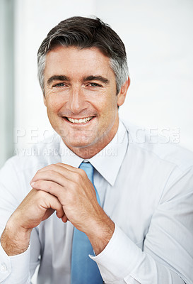 Buy stock photo Thoughtful mature businessman looking away with a smile