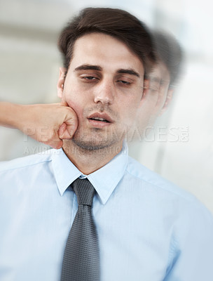 Buy stock photo Exhausted young businessman being knocked out by a fist