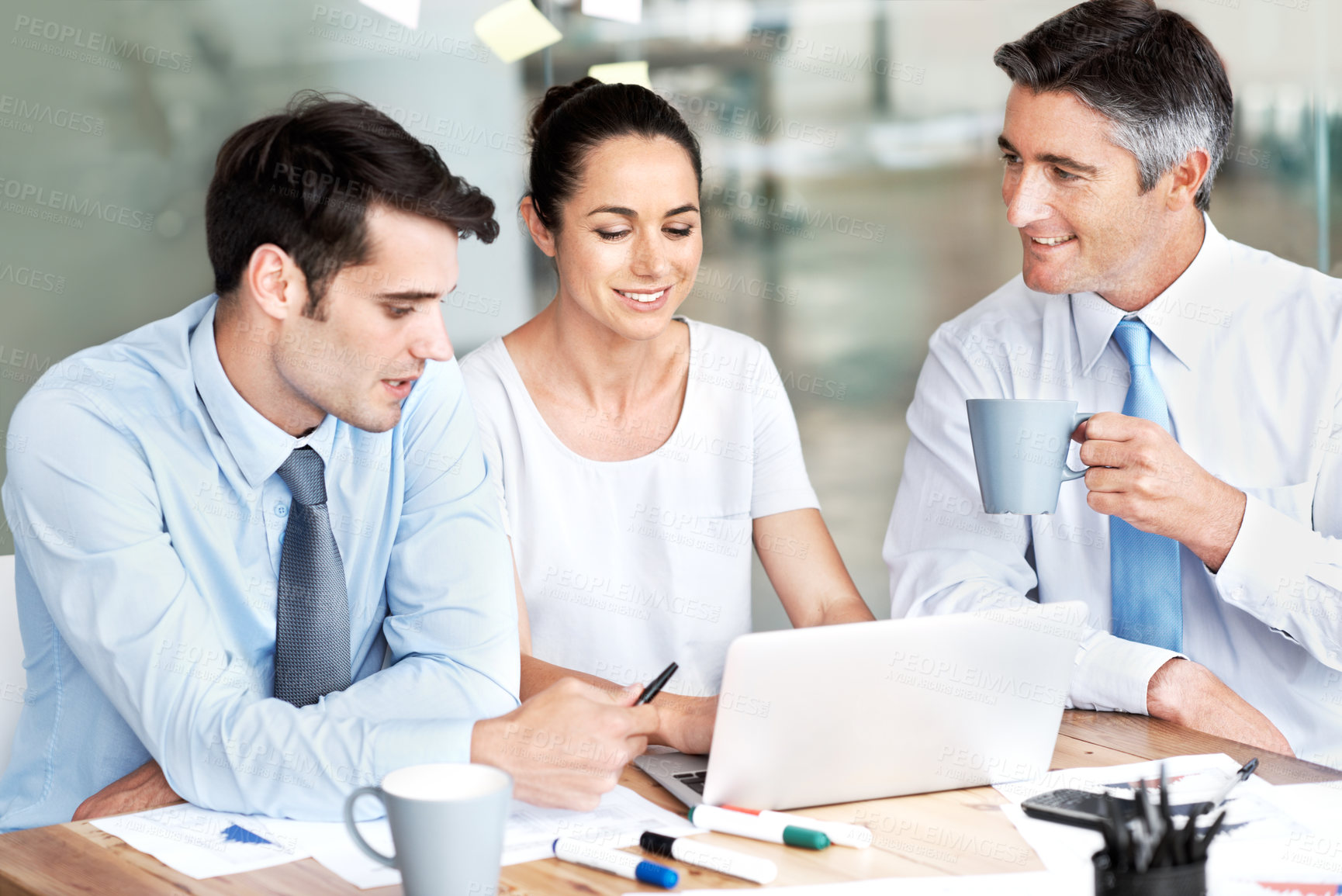 Buy stock photo Business people, team and laptop in office for planning, collaboration and accounting discussion. Men and a woman together in at desk with tech and paperwork for tax, budget or brainstorming strategy