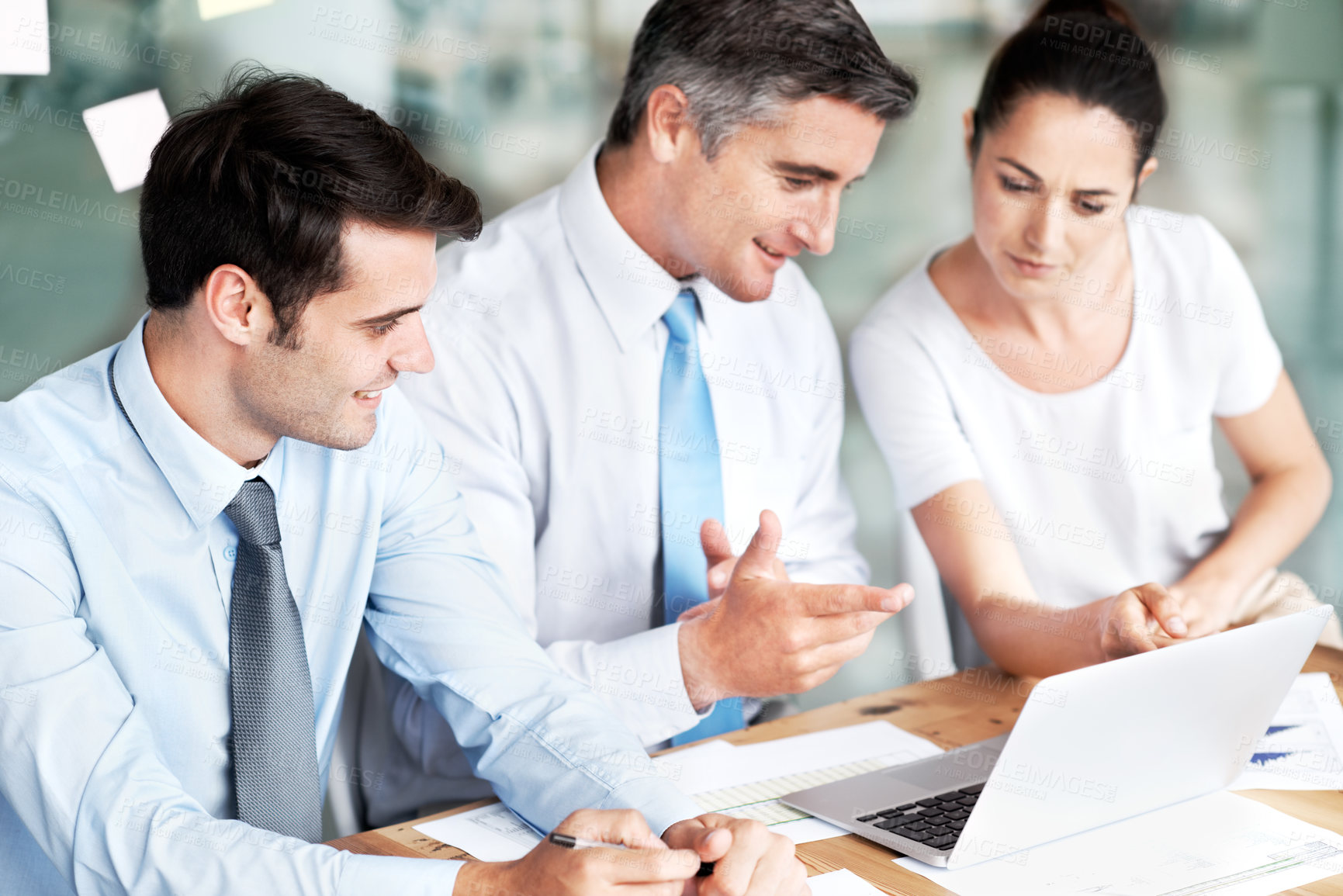 Buy stock photo Group of businesspeople working together on a project