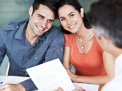Buy stock photo Happy young couple in a meeting with a financial consultant