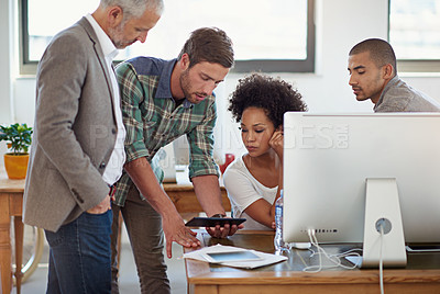 Buy stock photo A group of coworkers working together in the office