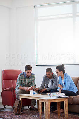 Buy stock photo Magazine, business people and meeting for design in office, teamwork and discussion for creativity. Employees, publication feedback and review of schedule for strategy, collaboration and project