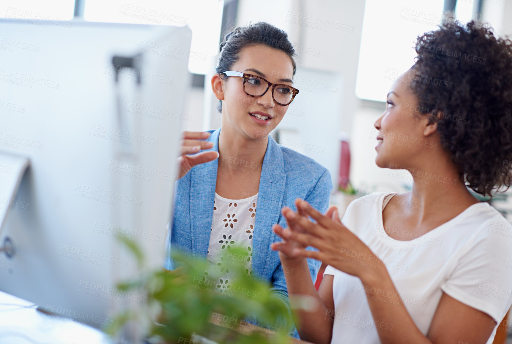 Buy stock photo Women, discussion and computer in office for brainstorming, project or colleague as web designer. Female people, technology and coworker for communication, teamwork or collaboration in digital agency