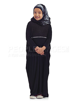 Buy stock photo Islamic clothes, young child and smile standing in white background for culture happiness, religion awareness or empowerment. Muslim girl, happy and religious fashion or hijab isolated in studio