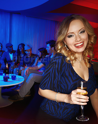 Buy stock photo A beautiful young woman enjoying drinks with her friends in the club