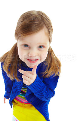 Buy stock photo Portrait of a playful little girl smiling and gesturing for you to be quiet while isolated against a white background