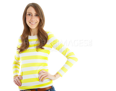 Buy stock photo Portrait of a pretty young woman smiling with her hands on her hips while isolated on white