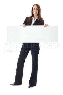 Buy stock photo Full body portrait of a confident businesswoman holding a placard for your copyspace - Isolated