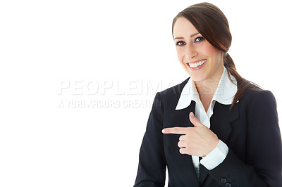 Buy stock photo A pretty young executive pointing towards copyspace while isolated on a white background