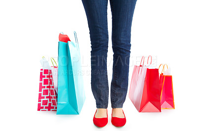 Buy stock photo Shopping, legs and customer with bags, studio and purchase with discount in mockup, deals and feet. White background, space and shopper of fashion in retail, person and luxury with sale and shoes