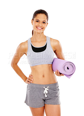 Buy stock photo A pretty young woman with a toned stomach holding an exercise mat against a white background