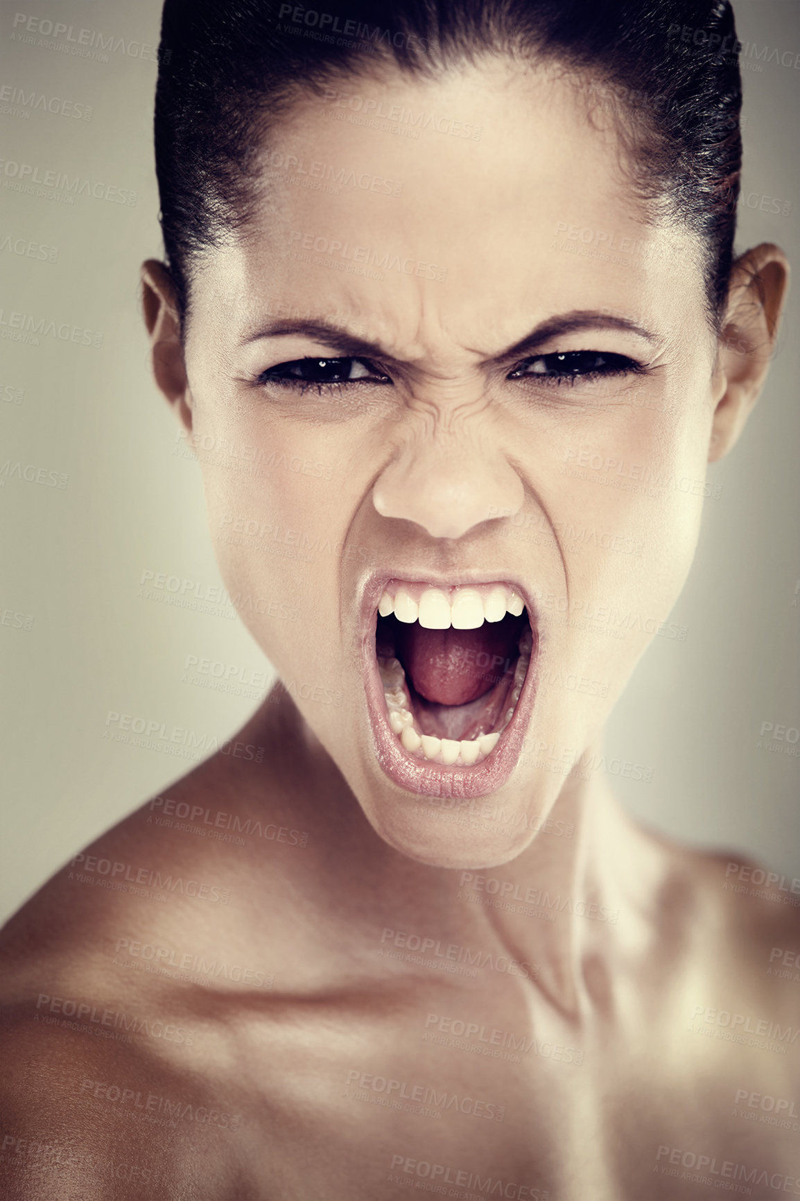 Buy stock photo Portrait of an angry young woman raging at you