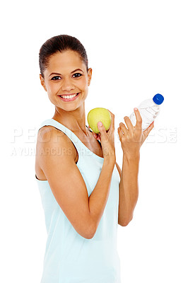 Buy stock photo Portrait of an attractive young woman holding a bottle of water and an apple