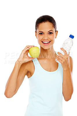 Buy stock photo Portrait of a happy young woman holding a bottle of water and an apple
