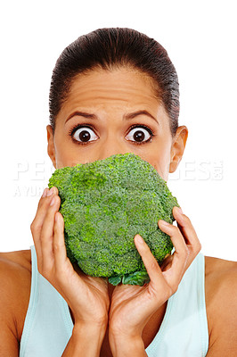 Buy stock photo Portrait of a beautiful young woman holding a head of broccoli in front of her mouth