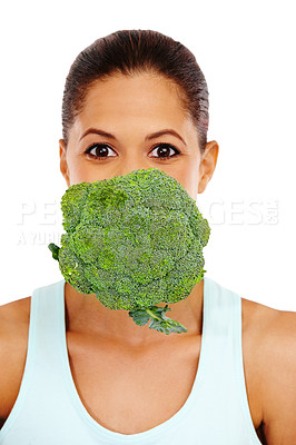 Buy stock photo Portrait of an attractive young woman with a head of broccoli floating in front of her mouth