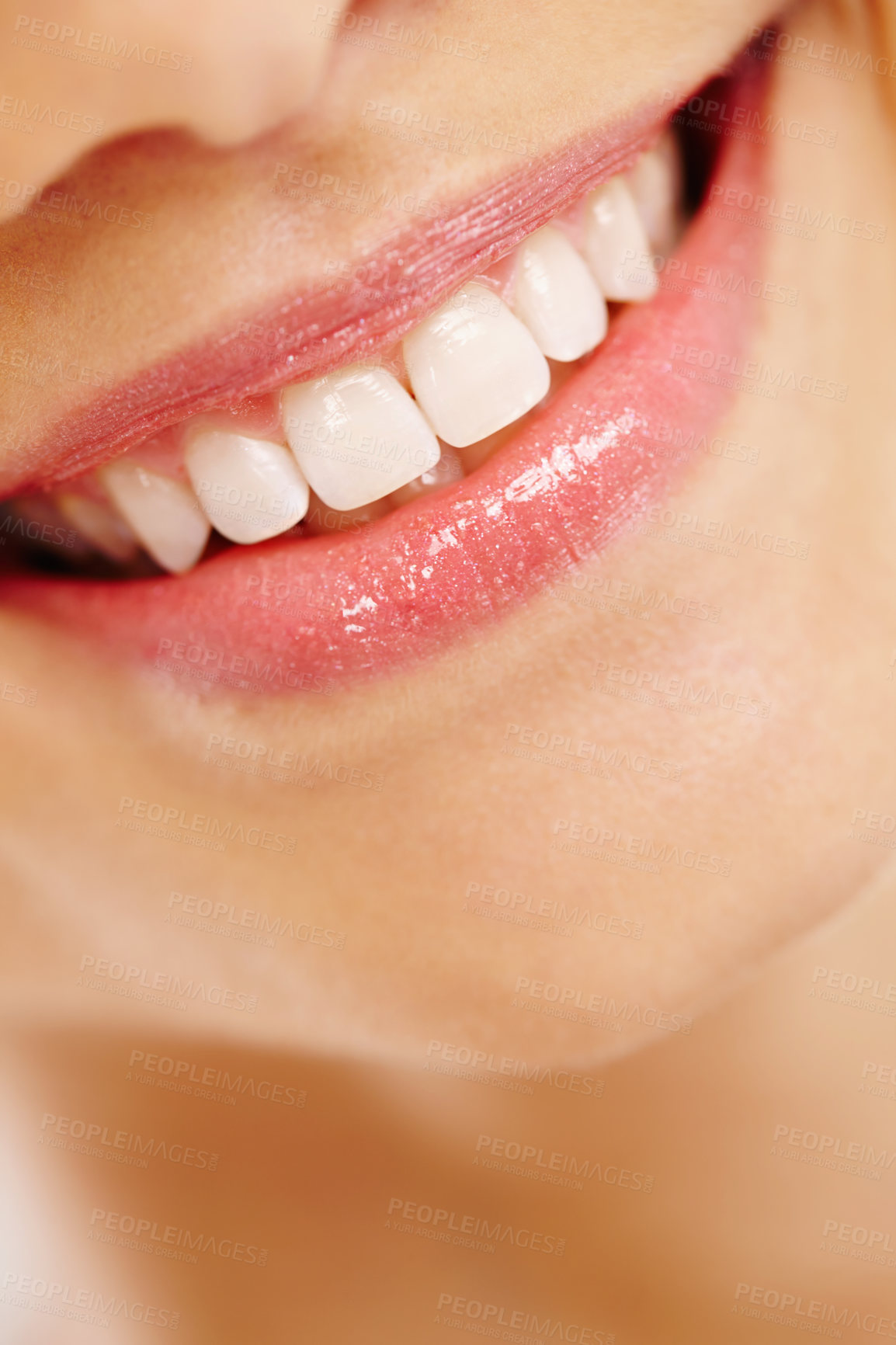 Buy stock photo Closeup of a happy woman's teeth with great oral hygiene and a beautiful toothy smile and showing her dental wellness. Taking daily care of her daily oral hygiene to maintain healthy clean gums
