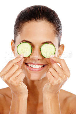 Buy stock photo Happy woman, cucumber eyes and cosmetics in studio, eco friendly skincare and nutrition for hydration. Female person, glow and organic beauty or facial treatment, dermatology and white background