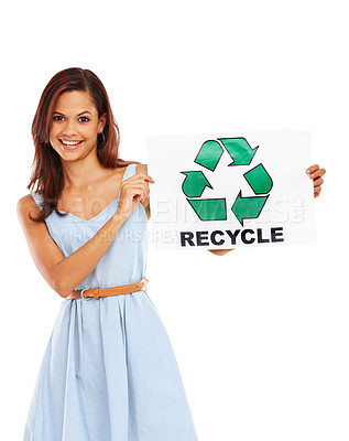 Buy stock photo Young woman smiling and holding up a poster with the recycling logo on it against a white background