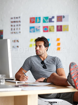 Buy stock photo Creative, man and research at desk in office for project budget planning, information and review. Business, workplace and athletics administrator with computer for online report, feedback and notes