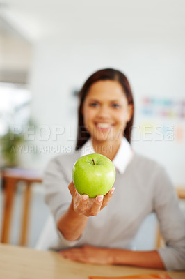 Buy stock photo Woman, green apple and fruit for a healthy lifestyle, diet and eating for health and wellness while sitting at home with a snack. Hand of female giving fresh and organic vegan food for nutrition