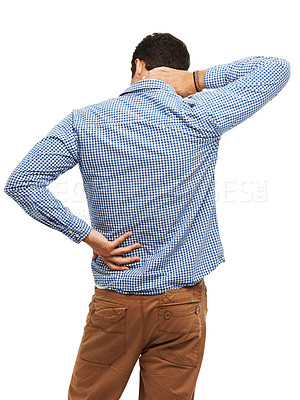 Buy stock photo Rearview of a young man holding his neck and back in pain