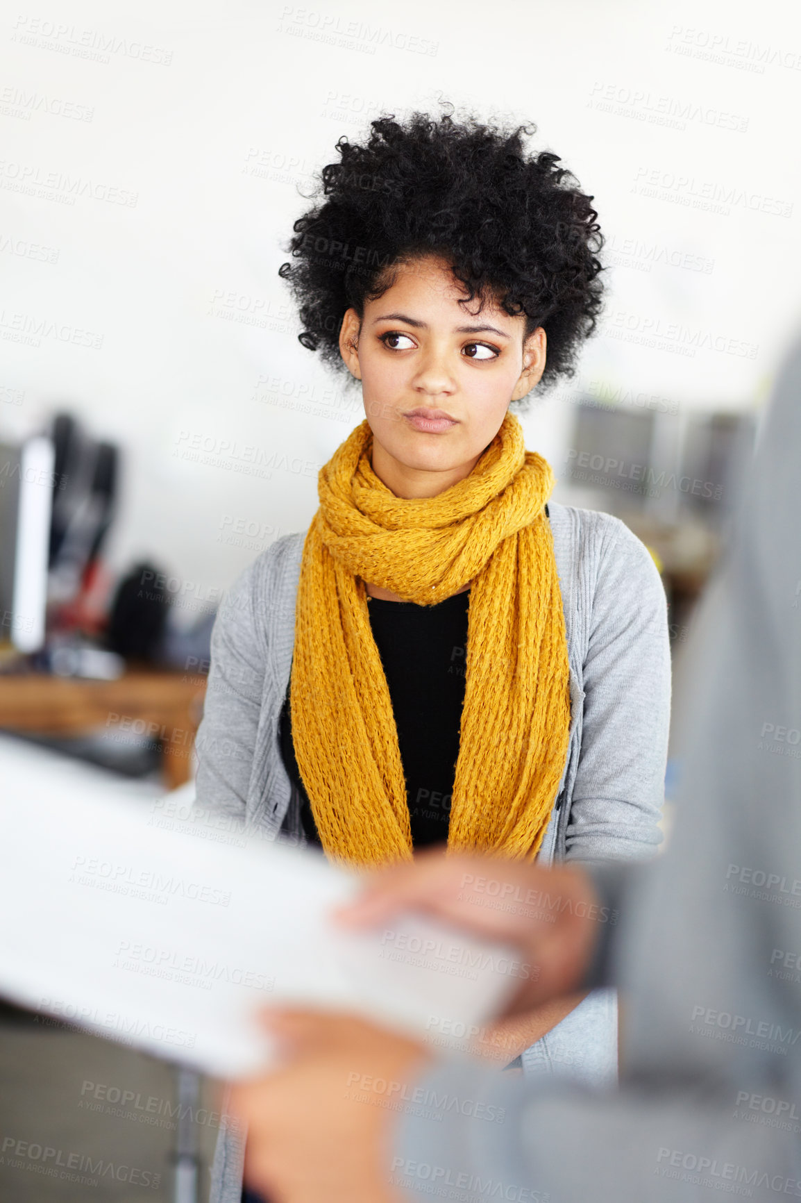 Buy stock photo An attractive young employee behind some paperwork