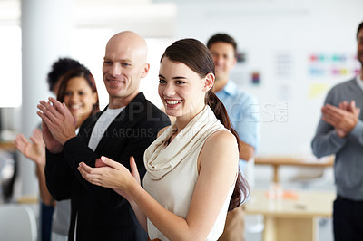 Buy stock photo A group of colleagues clapping during a meeting