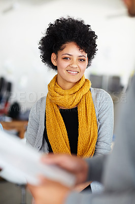 Buy stock photo Portrait of an attractive young employee behind some paperwork