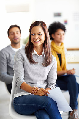 Buy stock photo Three employees sitting down during an office meeting