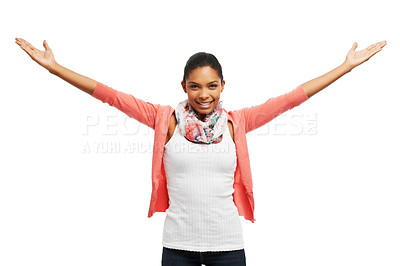 Buy stock photo Young woman smiling happily with her arms outstretched against a white background