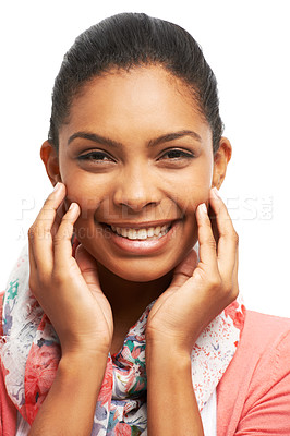 Buy stock photo Pretty young woman smiling while touching her face against a white background