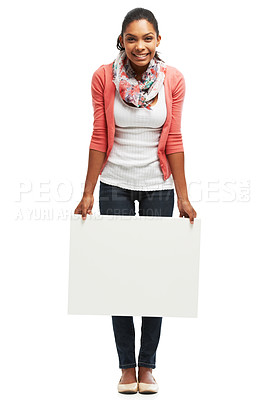 Buy stock photo Casual young woman holding white copyspace against a white background