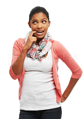 Buy stock photo Young woman biting her finger and trying to make a decision