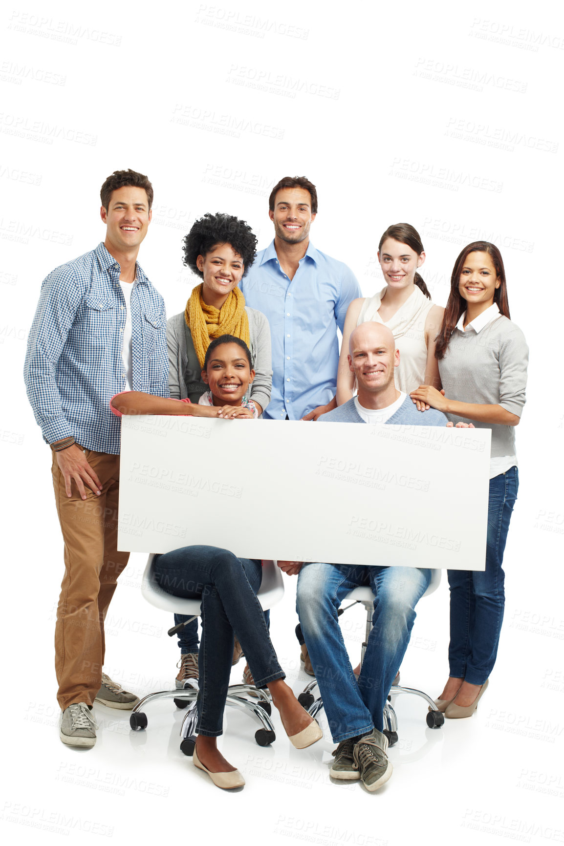 Buy stock photo Group of casually dressed young adults holding a poster of copyspace