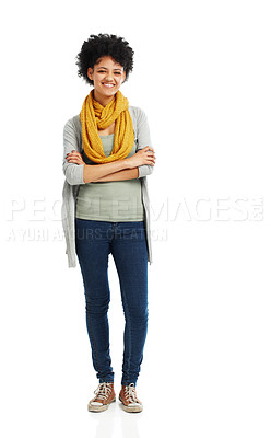 Buy stock photo Cute young woman standing against a white background with her arms folded