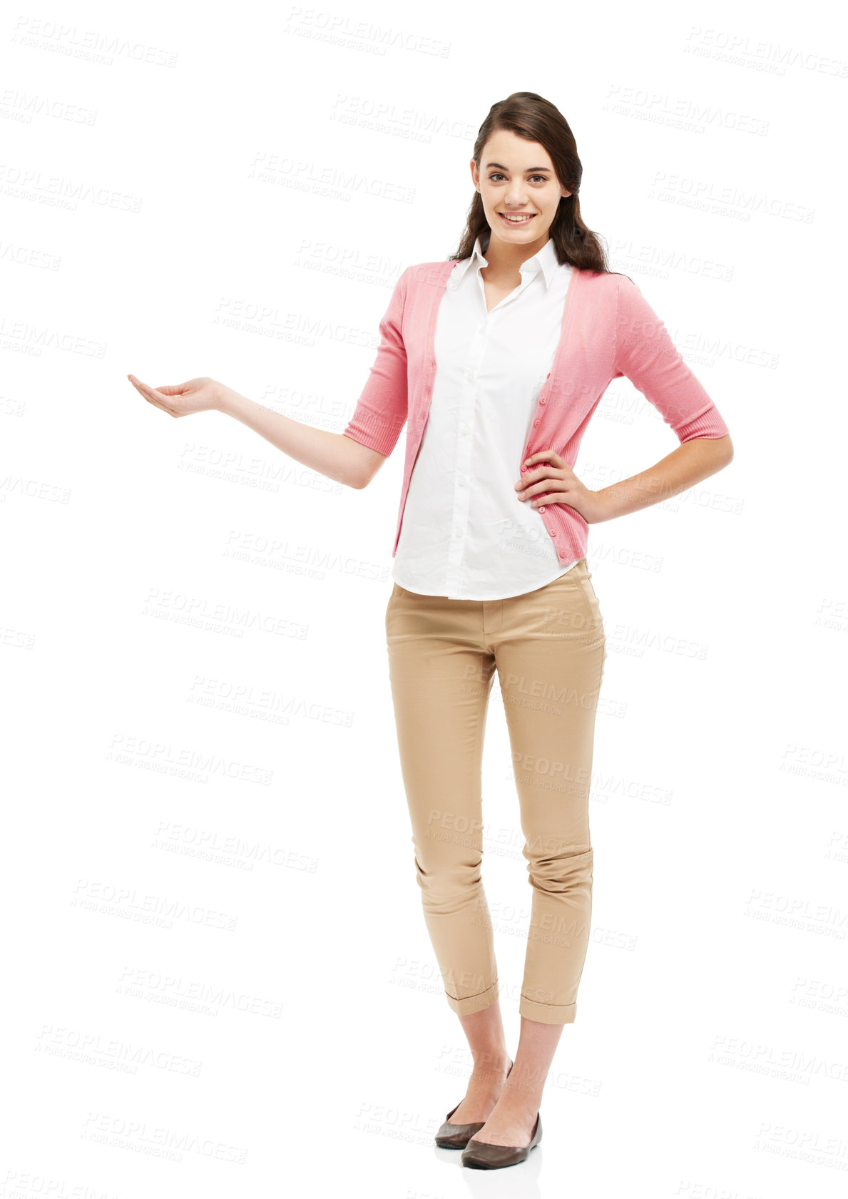 Buy stock photo Cropped view of a preppy young woman standing against a white background and gesturing towards copyspace