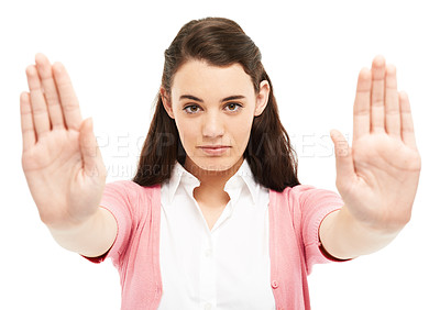 Buy stock photo Portrait, girl and stop with hand gesture in studio for protest announcement, warning sign and violence danger. Serious, woman and wait emoji for conflict attention, human rights and white background