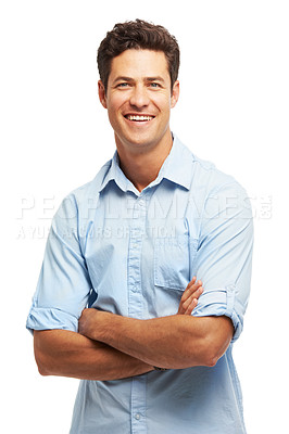 Buy stock photo Portrait of a handsome young man standing with his arms folded