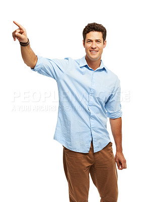 Buy stock photo A handsome young man pointing away