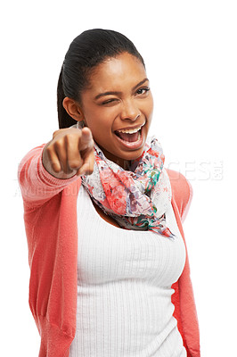 Buy stock photo A beautiful young woman winking while pointing towards the camera