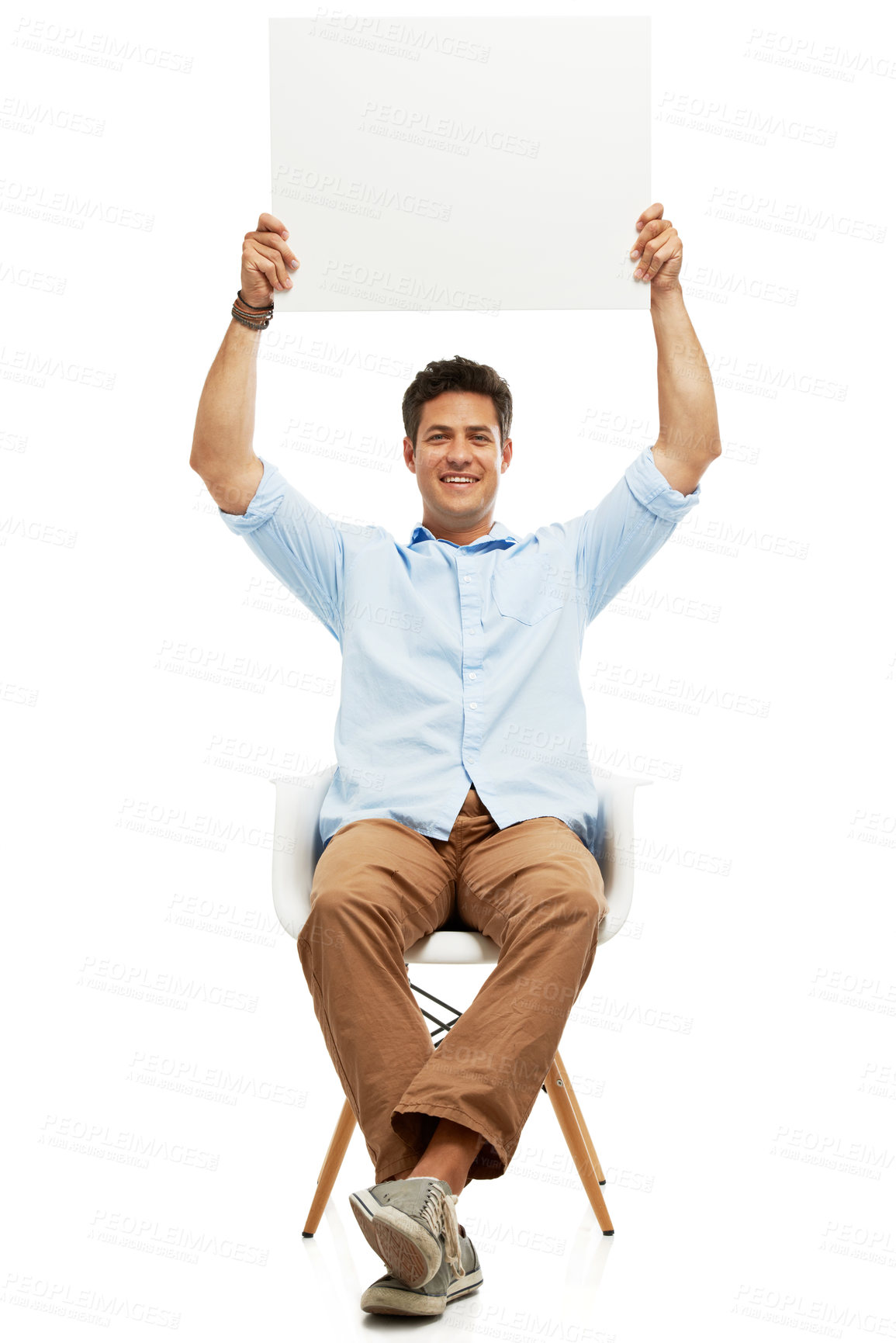 Buy stock photo A handsome young man holding up copyspace